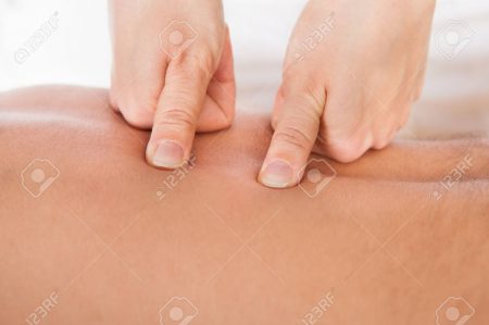 25156371-close-up-of-person-receiving-shiatsu-treatment-from-massager